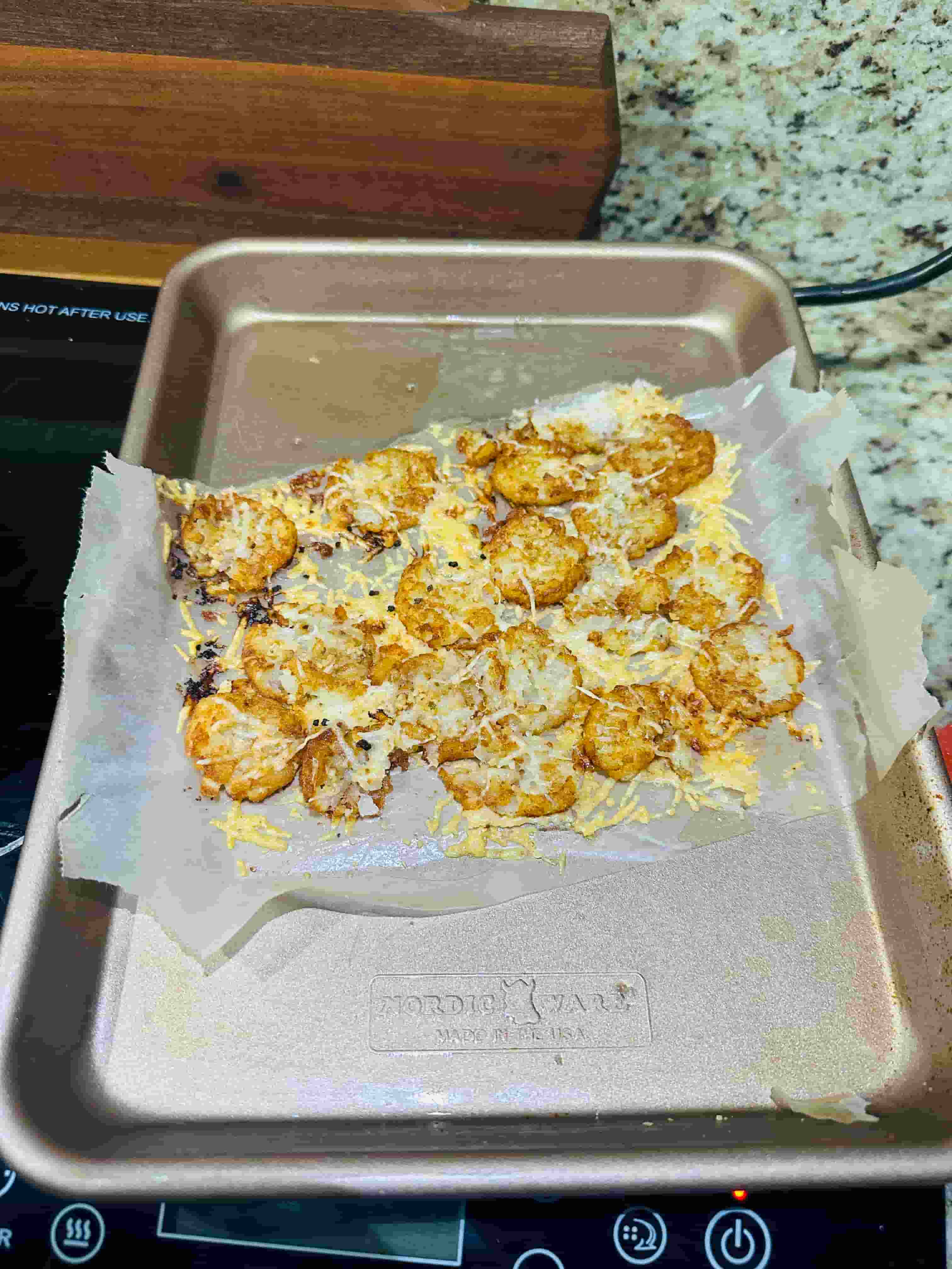 Parmeson and Garlic Tater Tots on a metal pan